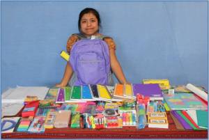 Girl from Mayan Families Displays New School Supplies