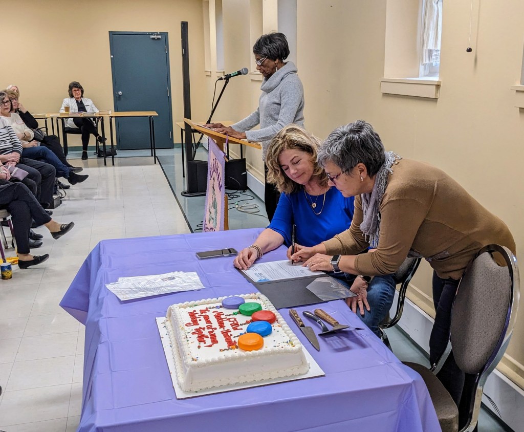 Inclusion committee speaker while president and treasurer sign inclusion charter