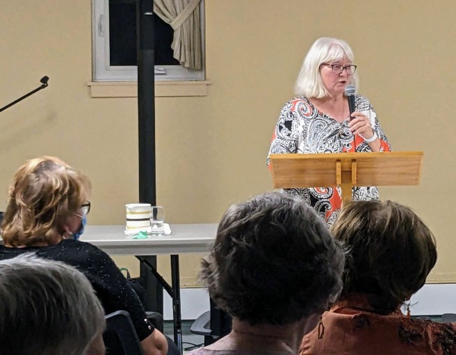 This year's president Sandra M at the podium