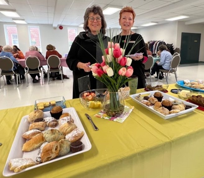 2 ladies with pastries at appreciation breakfast